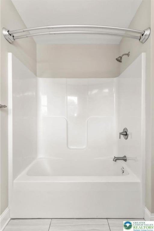 721 7th St, Whitehall Twp, PA 18052 - bathroom featuring baseboards, tub / shower combination, and tile patterned floors
