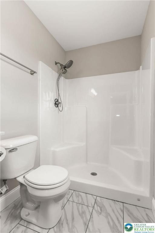 721 7th St, Whitehall Twp, PA 18052 - full bath with marble look tiles, a shower, and toilet