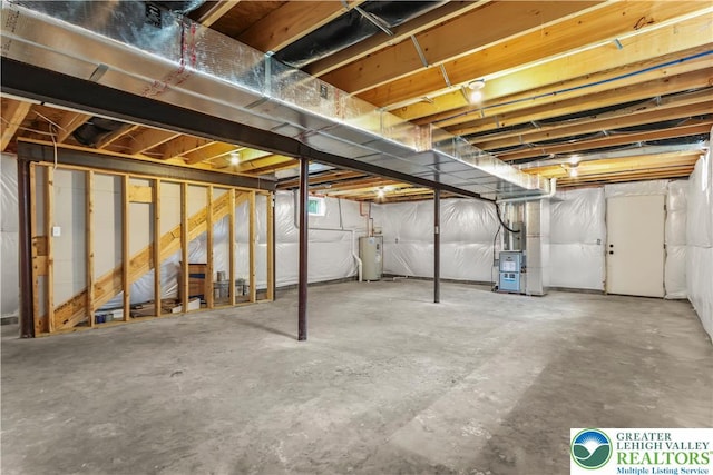 721 7th St, Whitehall Twp, PA 18052 - unfinished basement featuring water heater and heating unit