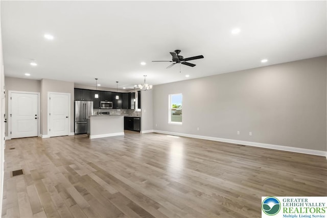 721 7th St, Whitehall Twp, PA 18052 - unfurnished living room with a ceiling fan, recessed lighting, baseboards, and light wood-type flooring