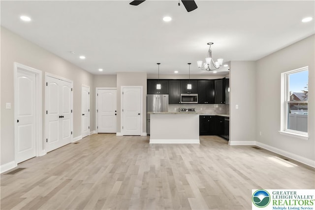 721 7th St, Whitehall Twp, PA 18052 - kitchen with stainless steel appliances, recessed lighting, dark cabinets, a ceiling fan, and light countertops