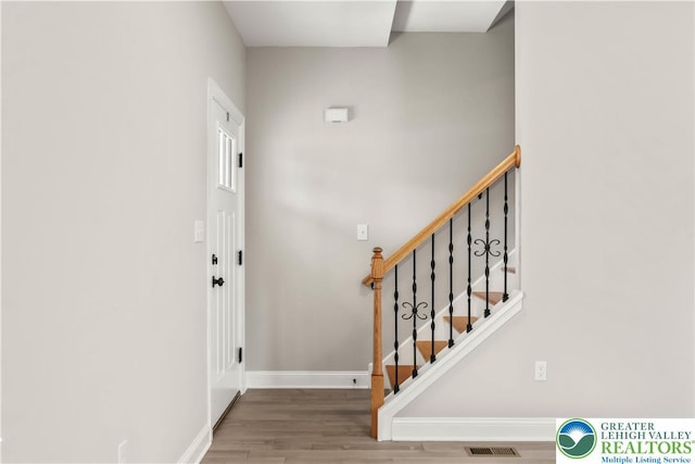 721 7th St, Whitehall Twp, PA 18052 - entryway with wood finished floors, baseboards, and stairway