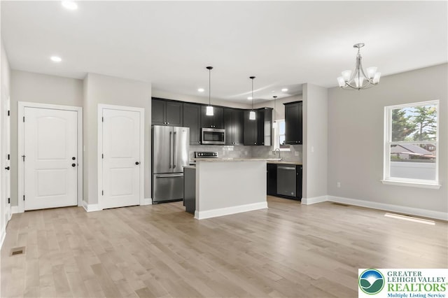 721 7th St, Whitehall Twp, PA 18052 - kitchen with appliances with stainless steel finishes, a sink, recessed lighting, light countertops, and a chandelier