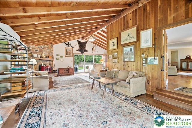 1132 Upperstump Rd, Hilltown Twp, PA 18914 - living room with wood finished floors, wooden walls, wood ceiling, and a stone fireplace