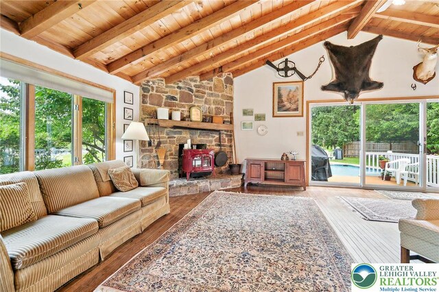 1132 Upperstump Rd, Hilltown Twp, PA 18914 - living room featuring a wood stove, wood ceiling, and hardwood / wood-style floors