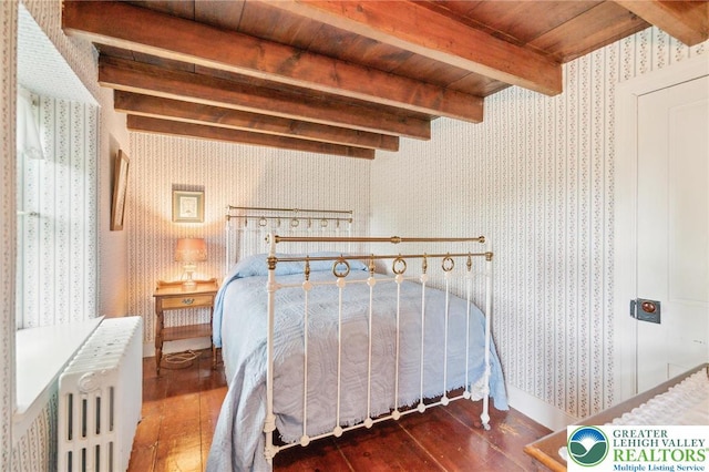 1132 Upperstump Rd, Hilltown Twp, PA 18914 - bedroom with radiator heating unit, wallpapered walls, wood-type flooring, and wood ceiling with exposed beams
