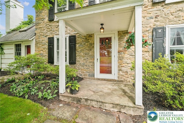 1132 Upperstump Rd, Hilltown Twp, PA 18914 - property entrance with stone siding and a porch
