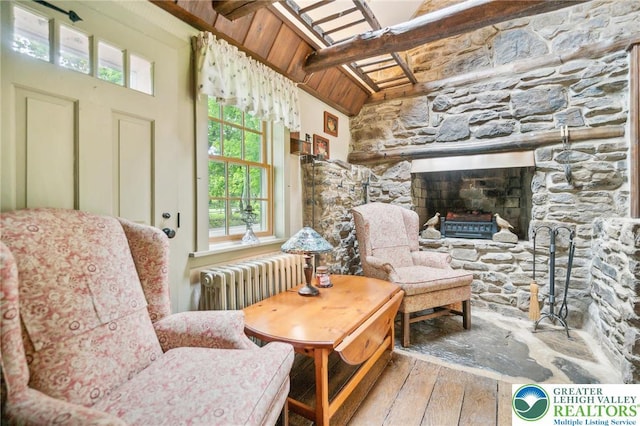 1132 Upperstump Rd, Hilltown Twp, PA 18914 - living area featuring radiator, hardwood / wood-style floors, wooden ceiling with exposed beams, and a fireplace