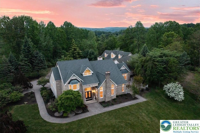 2630 Eagle Ln, Lower Saucon Twp, PA 18055 - traditional-style house with stone siding, a chimney, a yard, and a wooded view