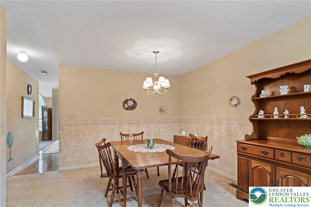 8077 Cross Creek Cir, Upper Macungie Twp, PA 18031 - dining space featuring a chandelier, wainscoting, and light colored carpet