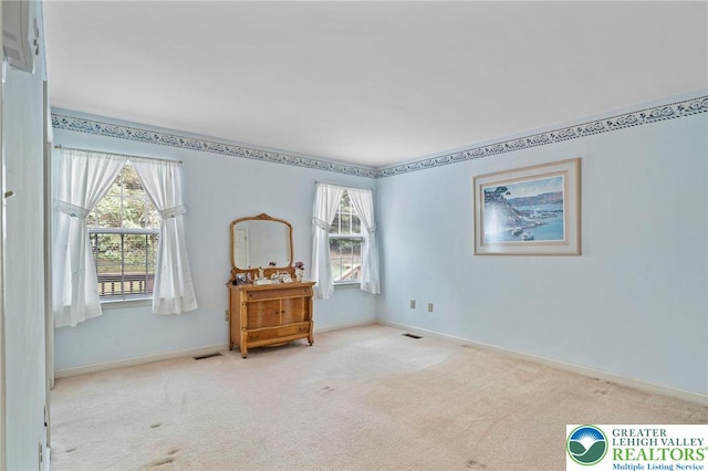 8077 Cross Creek Cir, Upper Macungie Twp, PA 18031 - carpeted empty room featuring plenty of natural light and baseboards