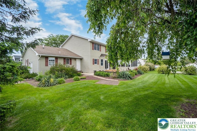 234 Venetian Dr, Forks Twp, PA 18040 - rear view of house with a lawn