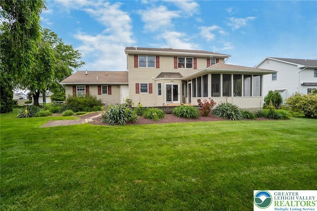 234 Venetian Dr, Forks Twp, PA 18040 - rear view of property with a sunroom and a lawn