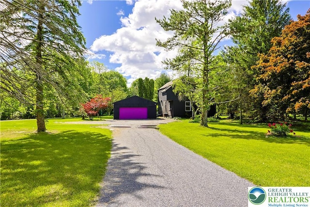 2671 Community, Moore Twp, PA 18014 - view of front of property with a garage, a front lawn, and an outbuilding