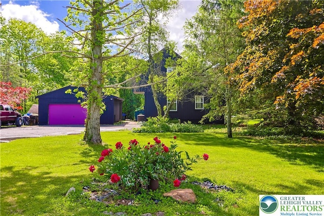 2671 Community, Moore Twp, PA 18014 - view of grassy yard with a garage and an outdoor structure
