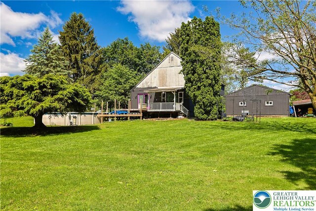 2671 Community, Moore Twp, PA 18014 - rear view of house featuring a lawn and a deck