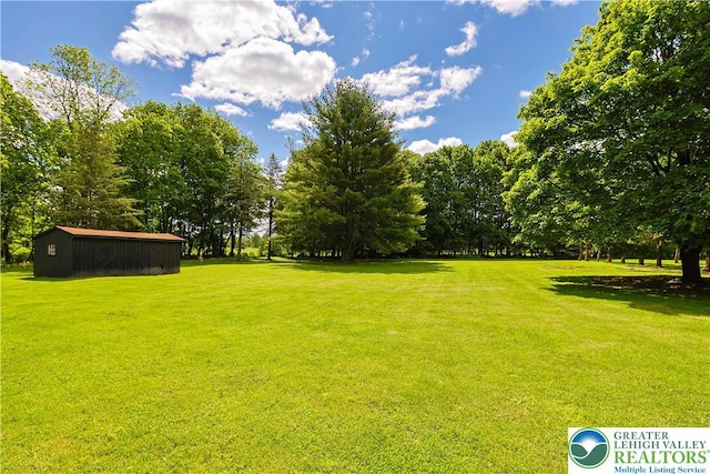 2671 Community, Moore Twp, PA 18014 - view of green lawn featuring view of scattered trees and an outdoor structure
