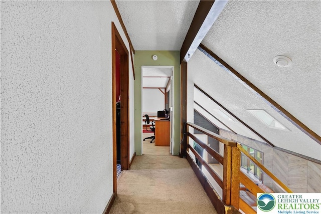 2671 Community, Moore Twp, PA 18014 - corridor with a textured ceiling, carpet flooring, and a desk