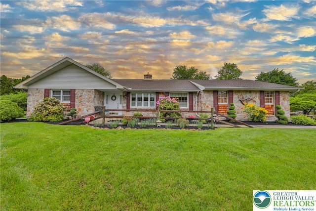 4379 Meadow Ln, South Whitehall Twp, PA 18104 - ranch-style house with stone siding, a yard, and a chimney