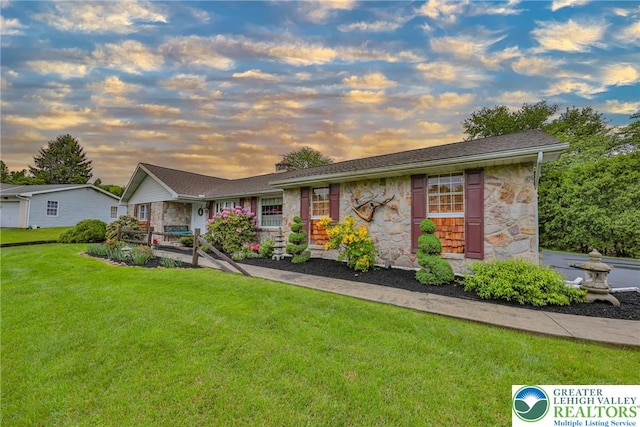 4379 Meadow Ln, South Whitehall Twp, PA 18104 - single story home featuring stone siding and a lawn