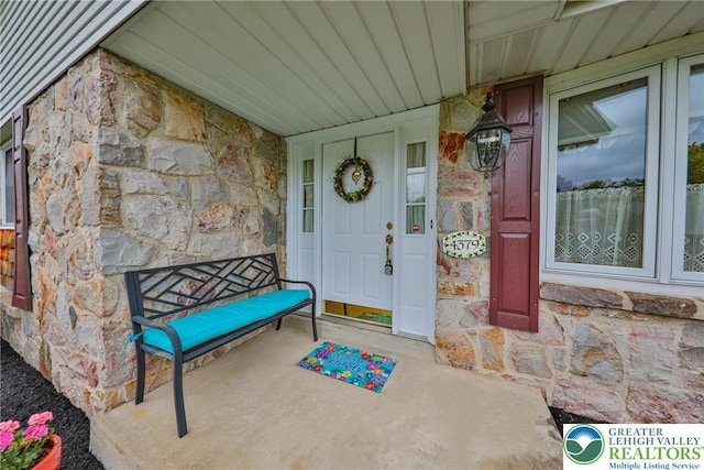 4379 Meadow Ln, South Whitehall Twp, PA 18104 - property entrance with stone siding and covered porch