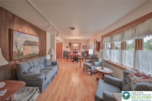4379 Meadow Ln, South Whitehall Twp, PA 18104 - living area featuring a chandelier, light wood-style floors, and track lighting