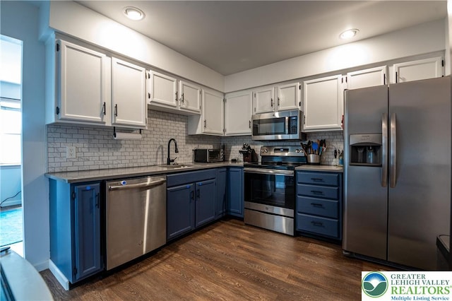 1411 Howard Ln, Palmer Twp, PA 18045 - kitchen with appliances with stainless steel finishes, a sink, blue cabinets, dark wood-style flooring, and recessed lighting