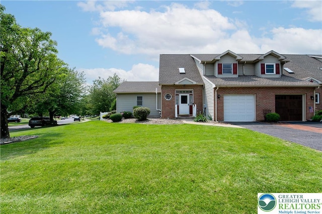1411 Howard Ln, Palmer Twp, PA 18045 - view of front of property with brick siding, asphalt driveway, a front lawn, and an attached garage