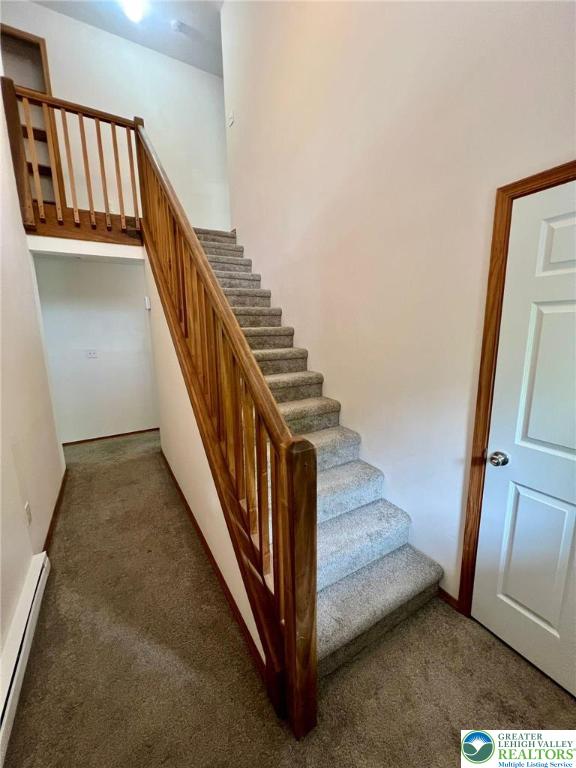 133 Summerton Cir, Stroud Twp, PA 18301 - stairs with a baseboard heating unit and carpet