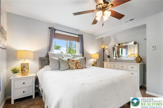 201 S 15th St, Emmaus Borough, PA 18049 - bedroom with dark carpet, baseboards, and a ceiling fan