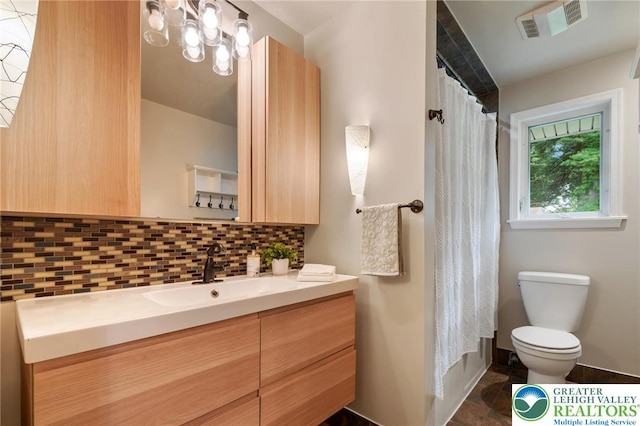 201 S 15th St, Emmaus Borough, PA 18049 - full bathroom featuring toilet, vanity, backsplash, and a shower with curtain