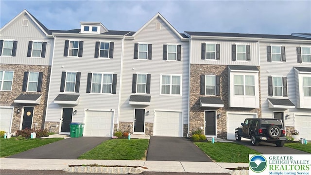 4904 Brookside Ct, Upper Saucon Twp, PA 18036 - view of property featuring stone siding, a garage, and driveway