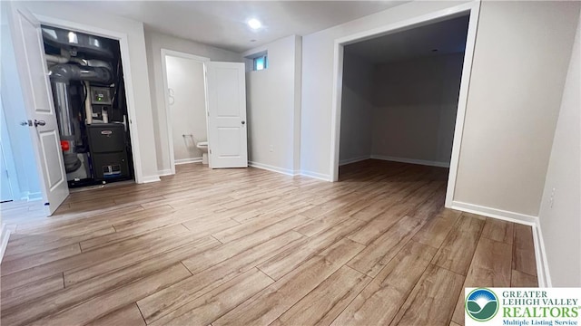 4904 Brookside Ct, Upper Saucon Twp, PA 18036 - unfurnished bedroom with wood finished floors, baseboards, and ensuite bath