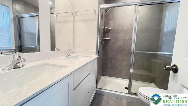 4904 Brookside Ct, Upper Saucon Twp, PA 18036 - full bath with toilet, a stall shower, double vanity, and tile patterned floors