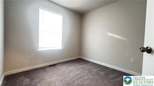 4904 Brookside Ct, Upper Saucon Twp, PA 18036 - spare room featuring dark carpet and baseboards