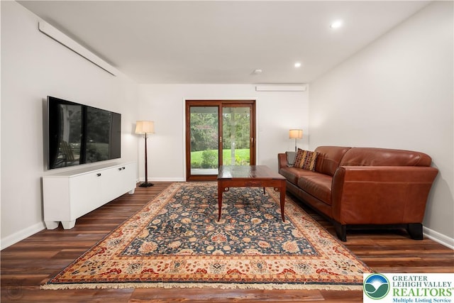 1580 Old Bethlehem Rd, Springfield Twp, PA 18951 - living area featuring dark wood finished floors, baseboards, recessed lighting, and an AC wall unit