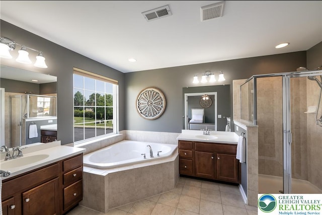 1838 Hemming Way S, Whitehall Twp, PA 18069 - full bathroom featuring two vanities, tile patterned flooring, a stall shower, and a garden tub