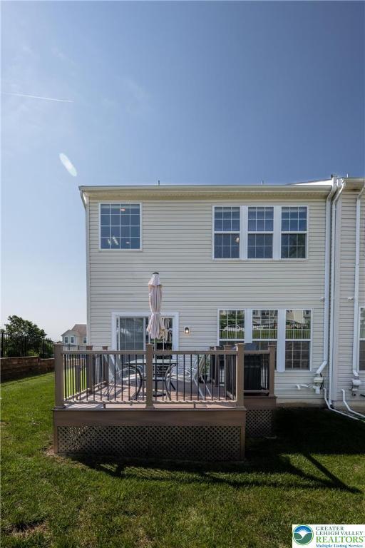 1838 Hemming Way S, Whitehall Twp, PA 18069 - rear view of property featuring a lawn and a wooden deck