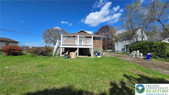 1126 Charles St, Luzerne, PA 18702 - back of property featuring stairs, a lawn, and a deck