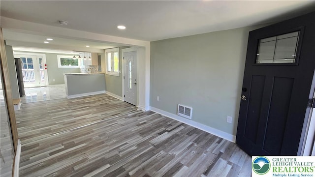 1126 Charles St, Luzerne, PA 18702 - entrance foyer featuring wood finished floors, baseboards, recessed lighting, and a chandelier