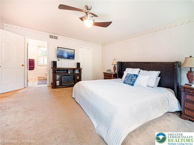 5054 Rainbow Ct, Lower Macungie Twp, PA 18106 - bedroom featuring light colored carpet, connected bathroom, and a ceiling fan