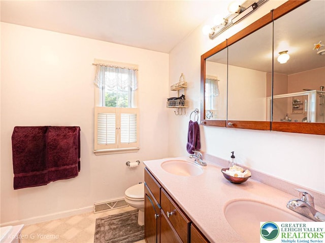 5054 Rainbow Ct, Lower Macungie Twp, PA 18106 - bathroom with baseboards, toilet, double vanity, and a shower with shower door