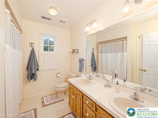 5054 Rainbow Ct, Lower Macungie Twp, PA 18106 - bathroom with double vanity, toilet, baseboards, tile patterned floors, and curtained shower