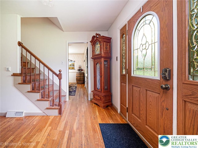 5054 Rainbow Ct, Lower Macungie Twp, PA 18106 - entrance foyer with light wood finished floors, stairway, and baseboards