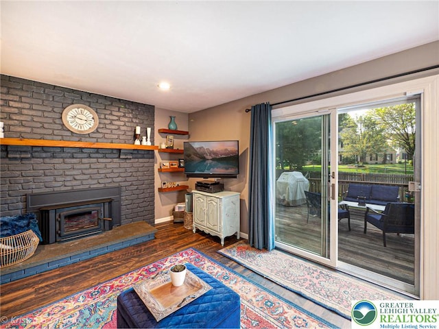 5054 Rainbow Ct, Lower Macungie Twp, PA 18106 - living room with wood finished floors, baseboards, a brick fireplace, and recessed lighting