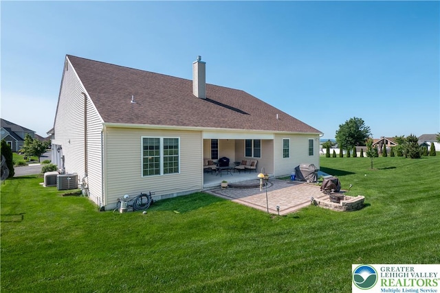222 Danbury Dr, Bushkill Twp, PA 18064 - back of property featuring an outdoor fire pit, a chimney, a patio area, a lawn, and central air condition unit