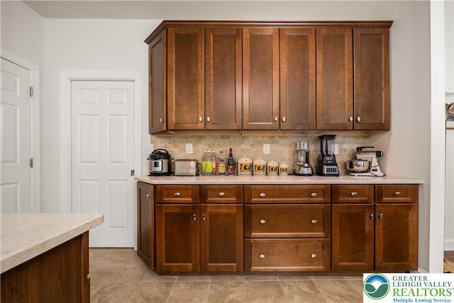 222 Danbury Dr, Bushkill Twp, PA 18064 - kitchen featuring tasteful backsplash and light countertops