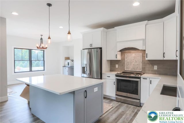 448 Long Lane Rd, Lehigh Twp, PA 18088 - kitchen with stainless steel appliances, decorative backsplash, light wood-style flooring, light countertops, and recessed lighting