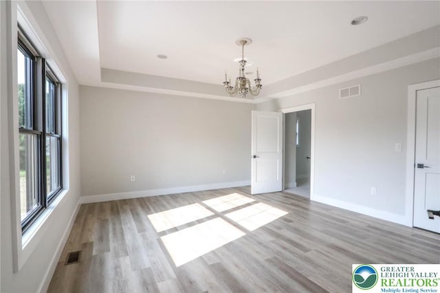 448 Long Lane Rd, Lehigh Twp, PA 18088 - spare room with healthy amount of natural light, a chandelier, baseboards, and light wood-style flooring