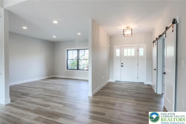 448 Long Lane Rd, Lehigh Twp, PA 18088 - foyer with a barn door, baseboards, wood finished floors, and recessed lighting